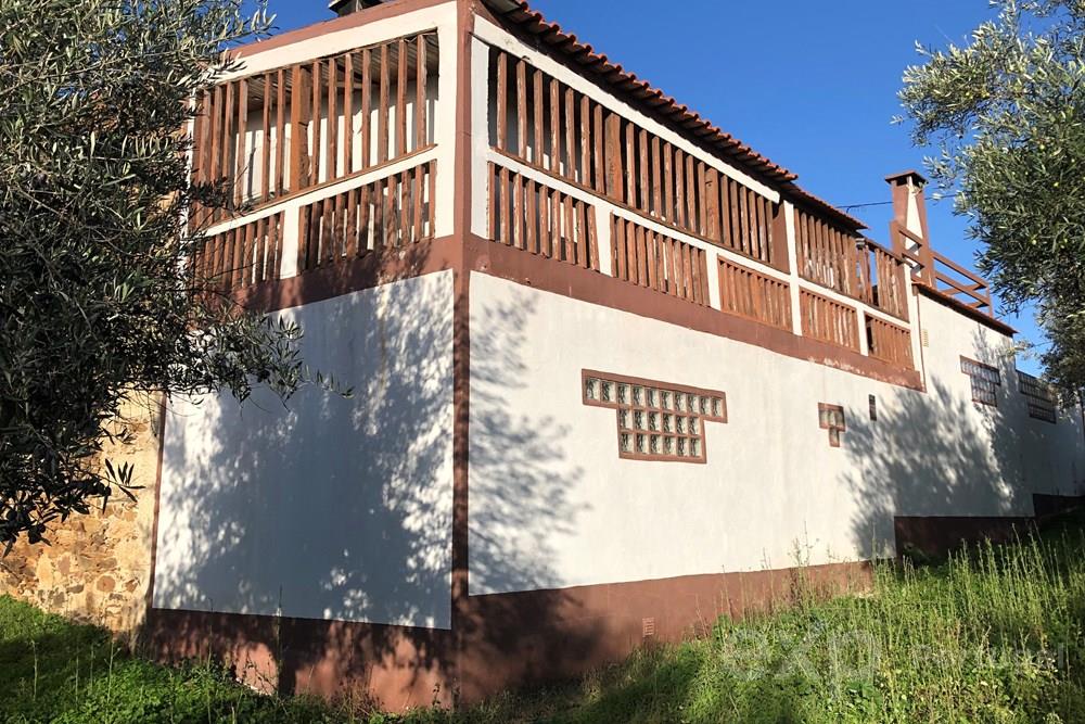 Stone house lovingly built using traditional features that capture comfort and modernity.